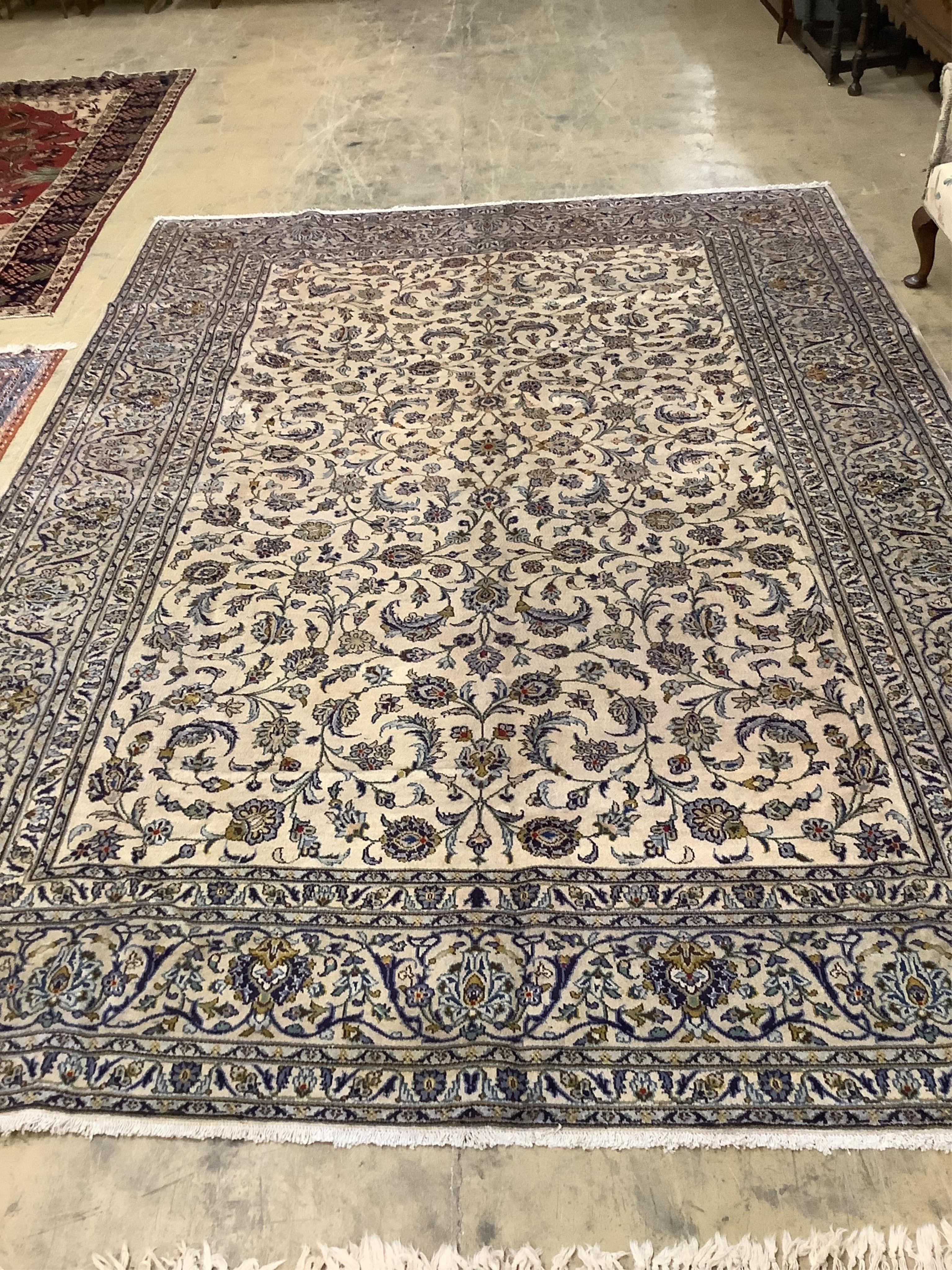 A Kashan ivory ground carpet, 390 x 274cm. Condition - good